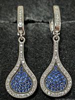 Front view of both earrings closed showing pavé stones and teardrop shape