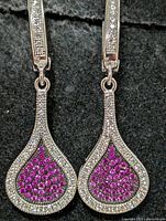 front view of both earrings showing pavé pink CZ fronts and latch backs