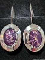 front view showing both earrings and stones