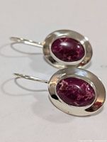 Front view showing oval pink thulite stones in silver settings