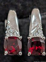Front view showing red garnets and accent stones