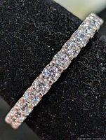 angled close-up of ring showing clear CZ stones