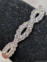 Close-up of twisted CZ design on ring front