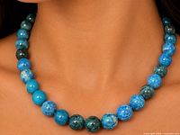 Necklace worn on model showing bead colour and fit