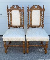 front view of both carved oak chairs