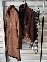 All three garments hanging on rack
