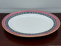 Full view of platter front showing shape and border design