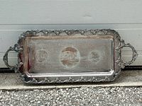 Full view of silver-plated rectangular tray showing grape border and handles