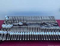 Full layout of flatware pieces on board