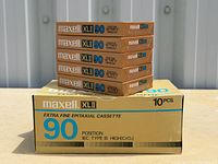 Stack of five sealed tapes on original 10-pack box