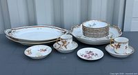 Group shot of entire lot showing quantity and variety of porcelain pieces