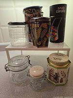 Group shot of all jars and tins on two-tier stand