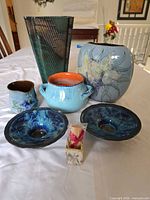 Group shot of all seven ceramic pieces on table