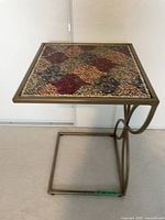 Full view of brass-plated mosaic side table