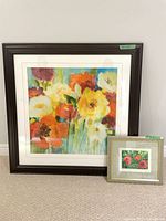 Large and small framed floral prints side by side