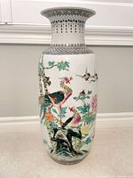 Full view of porcelain floor vase with bird and floral design
