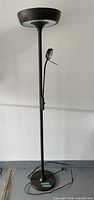Full view of torchiere floor lamp showing uplight bowl, reading lamp, pole and base