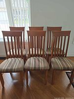 Six dining chairs grouped together showing front view