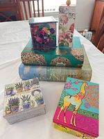 All six decorative storage boxes grouped, showing designs and relative sizes