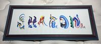 Front view of framed printed artwork spelling “Sharon”