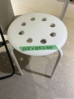 white metal stool with measurement label visible