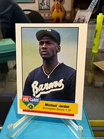 Front view of oversized Fleer ProCards Michael Jordan Birmingham Barons card displayed on stand