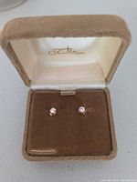 Diamond stud earrings in presentation box