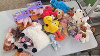 Overall view of assorted plush toys on table
