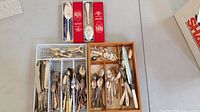 Overview of two trays and boxed serving pieces