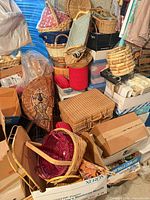 Pile of assorted wicker, wooden and plastic containers