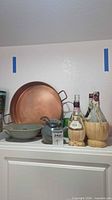 Full lot showing tray, bottles, teapot, bowl, vase