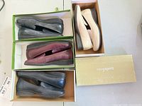 All four pairs of Easy Spirit loafers in boxes showing colors and style