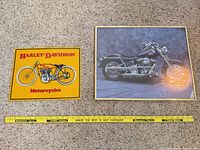 Both framed prints with measuring tape for scale