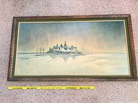 Front view of framed print showing full artwork and decorative frame with measuring tape for scale