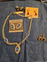 Full lot: necklace, bracelet, four pairs of earrings