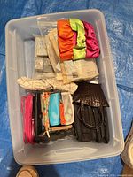 Overview of bin with assorted cosmetic bags and pouches