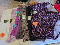 Six briefs laid out showing colours, prints and hang tags