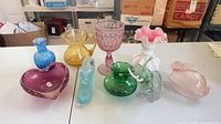 Full lot of assorted glassware on table