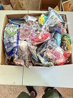 Box filled with sealed Happy Meal toys