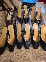 Overview showing all five pairs lined in boxes and on carpet