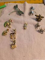 Group shot showing all ten animal/insect pieces