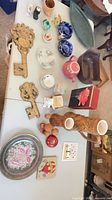 Overview showing keys, tray, glass pitcher, teapot, platter, swirl balls, crystal bowl, wood candleholders and assorted small ceramics
