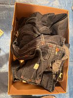 box containing denim garments