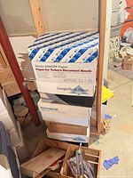 stack of Xerox, Georgia-Pacific and Hammermill paper boxes