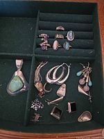 Full view of assorted jewelry pieces in tray