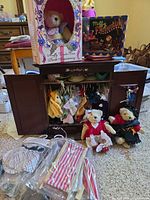 Overall lot showing wardrobe, bears, boxed items, loose outfits
