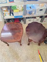 Top view of both Queen Anne tables showing shape and finish wear