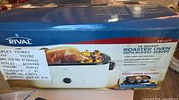 Factory sealed box front showing Rival 16-quart roaster oven and turkey image