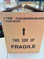 Outer box labeled 5 Tray Food Dehydrator #1876 + Food Slicer