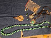 Group view showing all jewelry pieces laid on fabric